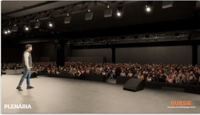 Render 3D com palestrante em cena diante do público.